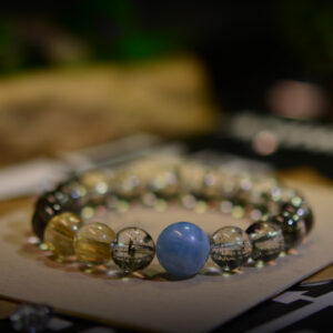 Explore our high-quality crystal bracelet, combining Green Phantom Ghost Quartz, Aquamarine, and Golden Hair Crystal for wealth and health benefits. Discover exquisite craftsmanship and guaranteed prosperity in every piece.